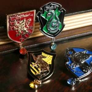 prendedor de Harry Potter metálicos con los escudos de las casas de Hogwarts y cristales colgantes brillantes chile