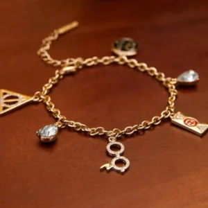 pulsera Harry Potter dijes dorada reliquias 9 3/4