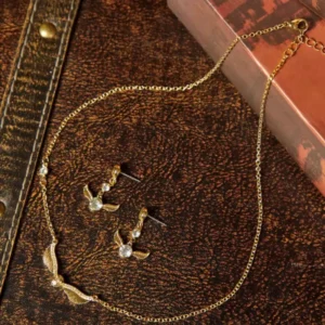 Juego aretes y collar snitch dorada