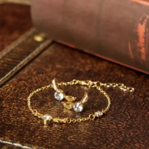 Juego Aretes y Pulsera Snitch Dorada